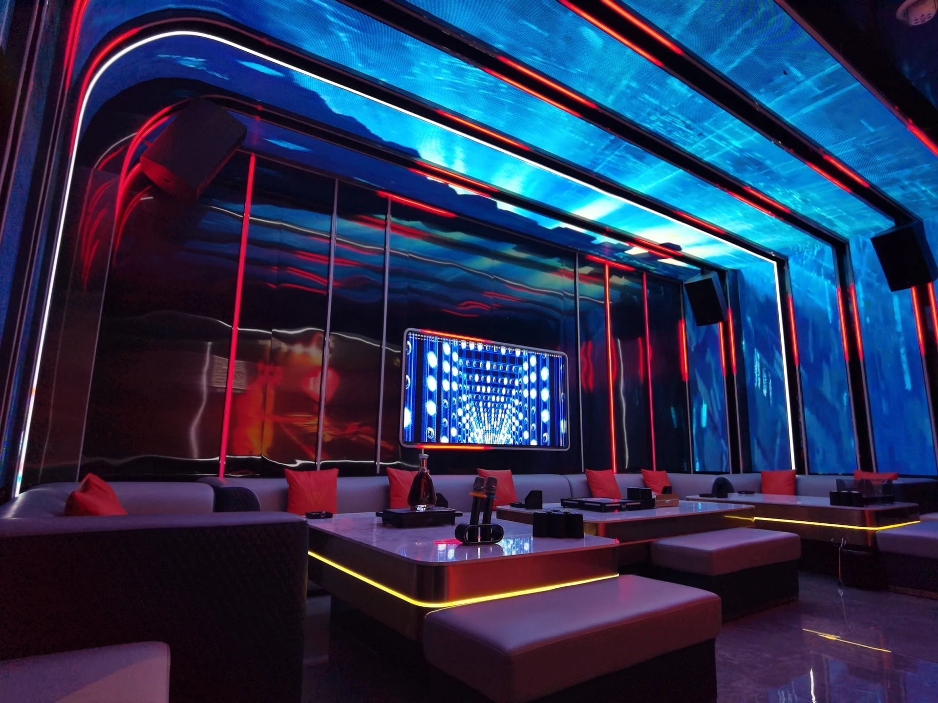 Party KTV design reference: Crimson Rhythm, with a luminous ceiling composition